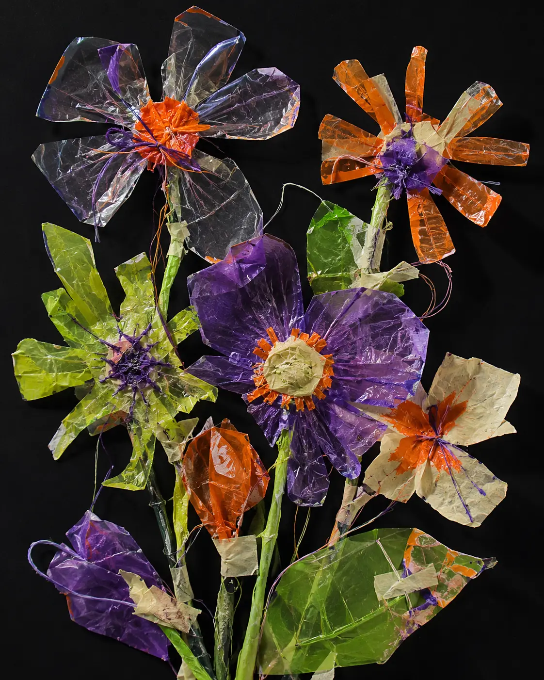Handmade flowers assembled from plastic and painted paper